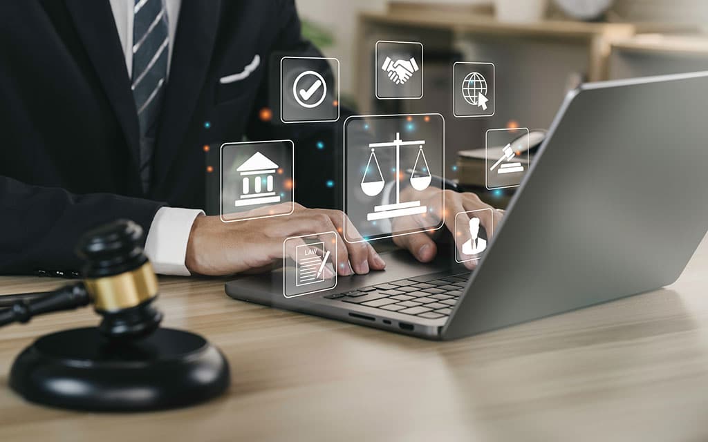 Conceptual image of a lawyer with a laptop and technology icons.