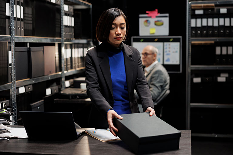 Workers busy storing case files in archives