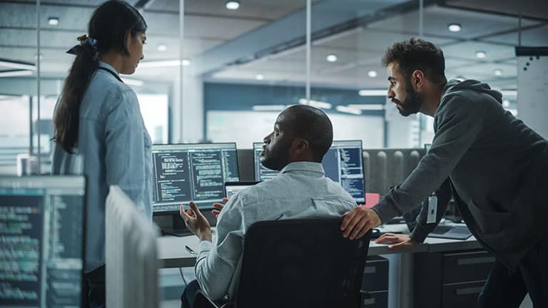 A response team discussing cybersecurity services with a consultant.