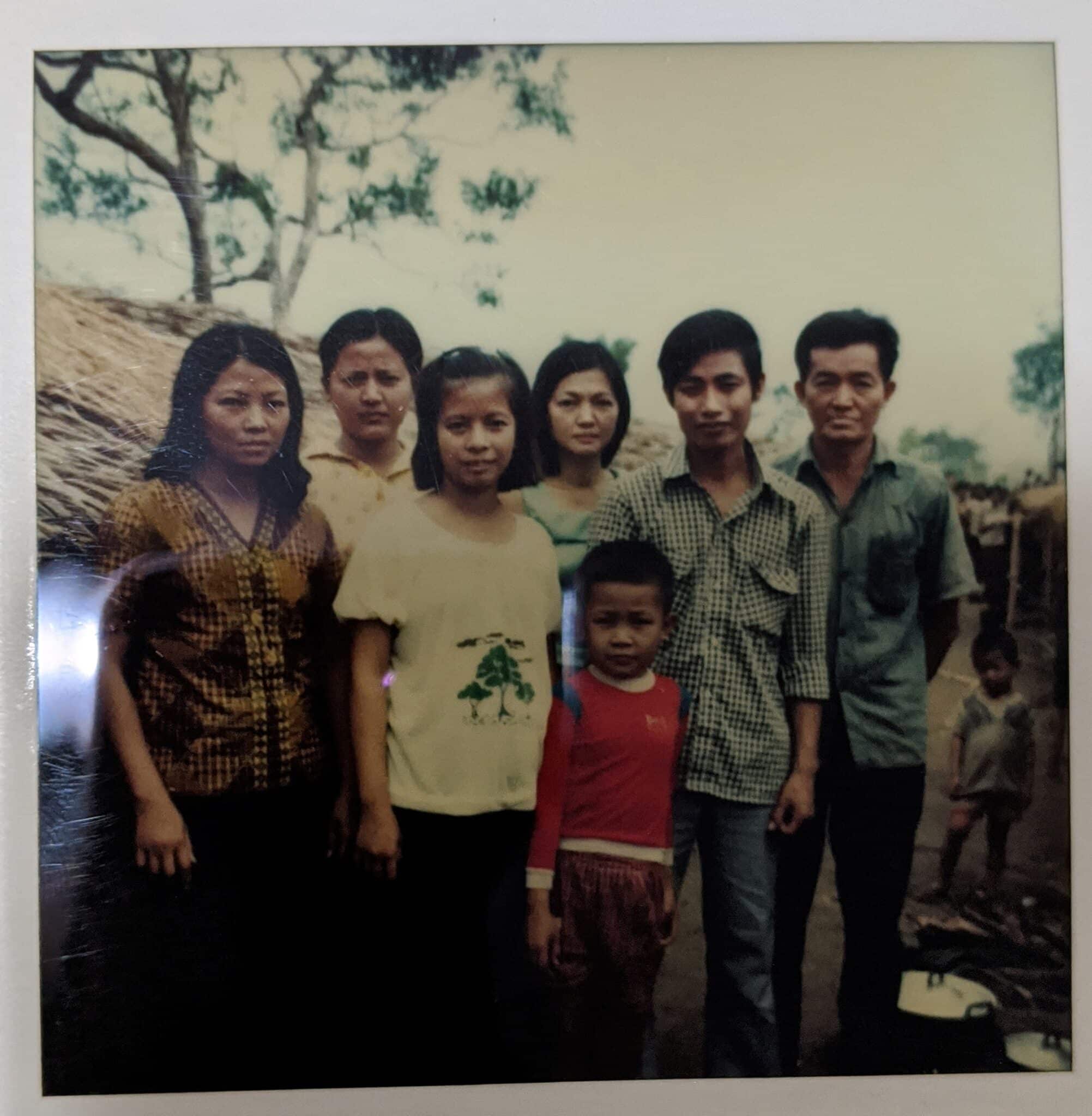Matthew Kaing with family in a refugee camp